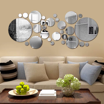 Set of 26 round, mirrored acrylic wall stickers.
